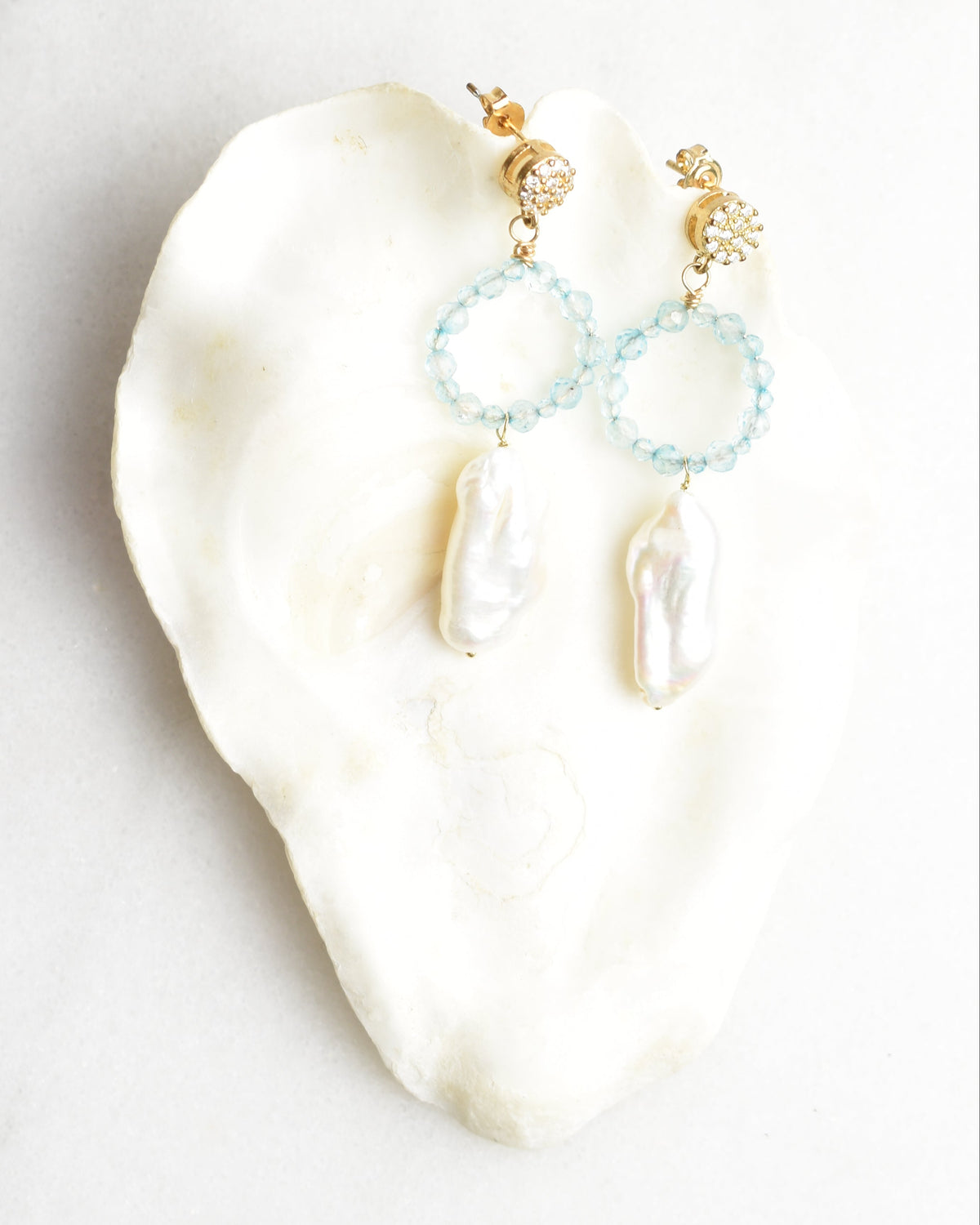 Sparkling Blue Elongated Pearl Post Earrings